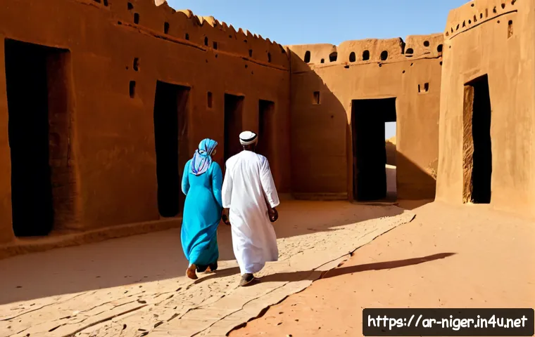 니제르 유적지 방문 - Photorealistic travel scene at an ancient earthen mosque and historic mud-brick ruins in Niger, a mo...